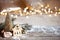 Christmas cozy background with decor details, snow and blurry lights copy space