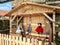 Christmas creche wooden with straw figures outdoors in public park