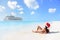 Christmas cruise travel - woman tanning on beach