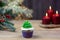Christmas cupcakes. Candles and an elegant spruce. Selective focus, place for text.