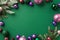 Christmas Day concept. Top view photo of purple green and pink baubles pine branches in snow and violet confetti on isolated green