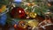 Christmas decor bitcoins, ball on a wooden board with pine branches and holiday lights. Coins bitcoin under the branch of a Christ