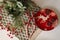 Christmas decor in the dining room in red, plate and red apples