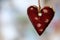 Christmas decor red ceramic heart, ornament hanging on sacking threads