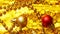 Christmas decor in red and gold on a golden sparkling background. Small gifts