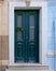 Christmas decorated house entrance vintage green door