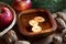 Christmas decoration - apples, pine branches, walnuts and floating candles in a bowl