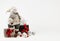 Christmas decoration background. Dressed Snowman toy pine tree in hand. xmas and christmas gifts, new year ornaments, silvery shin
