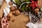 Christmas decoration background, fir tree, textile, beads, gifts, old paper, nuts and other stuff on sackcloth. Empty space for te