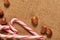 Christmas decoration background, fir tree, textile, beads, gifts, old paper, nuts and other stuff on sackcloth. Empty space for te