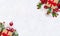 Christmas decoration, banner. Gift box with red ribbon, bow, twigs christmas tree, red berries and apples on snow