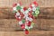 Christmas decoration. Buttons heart on wood background