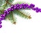 Christmas decoration. Christmas tree with violet balls on white background with space for text
