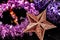 Christmas decoration close up, such as tinsel, stars and balls. new year decoration on a dark background