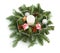 Christmas decoration consisting of fir twigs, shiny balls, cones around the candle, without snow on a white background