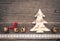 Christmas decoration of felt, christmas tree, bells and lace on