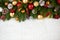 Christmas decoration on fir tree branch closeup, gifts, xmas ball, cone and other object on white blank space fur, holiday concept