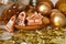 Christmas decoration with gold balls and keramic gingerbreads