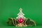 Christmas decoration green background with fir tree and apple