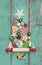 Christmas decoration on a green wooden background as a christmas