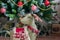 Christmas decoration in a living room, Deer toy and xmas tree in the background, holiday celebration