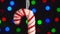 Christmas decoration, lollipop hanging on the bokeh background of flashing lights