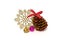 Christmas decoration pine cone with sparkles, shiny snowflake and handmade golden acorn on white background
