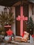 Christmas decoration of the porch of the house. The entrance door is decorated with a large red bow.