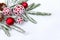 Christmas decoration. Red balls with white openwork, cones, branch christmas tree on snow with space for text