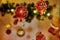 Christmas decoration with red and gold baubles. The red bauble on the left side is focussed