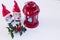 Christmas decoration with red lantern and holly. Porcelain Figurines,very charming boy and girl elves , on white backgrou