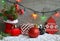 Christmas decoration:red Santa`s boot,fir tree,garland,gift,pine cone and toys on wooden background.Christmas background.