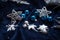 Christmas decoration on royal blue background. Top view on stars  wings and ornaments.