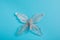 Christmas decoration silver butterfly on a blue background