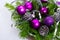 Christmas decoration with silver glitter cones and purple ornaments