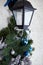 Christmas decoration of a street lamp on the porch of the cottage