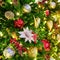 Christmas decoration of white poinsettia, bauble balls and red mistletoe