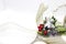 Christmas decoration with white ribbon and gold details. Silver angel