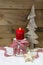 Christmas decoration:wooden tree,stars,candle and snow on wooden