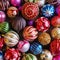 Christmas decorations. Beautiful red, golden, yellow balls with sparkles and stripes. Preparing for the New Year and