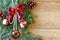 Christmas decorations - branches of coniferous trees with decorations on a wooden background