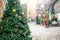 Christmas decorations on a Christmas tree in the form of red and gold balls. Christmas tree on a street in an european