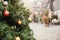 Christmas decorations on a Christmas tree in the form of red and gold balls. Christmas tree on a street in an european