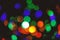 Christmas decorations concept. Defocused light of colorful garland. Festive backdrop with colorful lights. Bright and