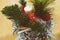 Christmas decorations of cones, fir branches, ball toy and candles on the table