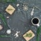 Christmas decorations, evergreen tree branch, snowflakes, coffee cup and gifts on gray plaid. Flat lay, top view. Christmas, New Y