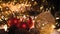 Christmas decorations, flashing lights, New Year 2022 4k background. Xmas tree red balls, gift, candle, fir cones