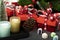 Christmas decorations with gift boxes, scented candle and marzipan sweets