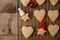 Christmas Decorations with Gingerbread cookies, festive decorative toy on tray and the vintage wooden background. Hygge rustic