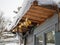 Christmas decorations glass globes on the chalet covered with snow early in